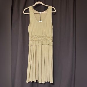 A loves A Dress is leaf/white color. Elastic peplum/ruched waist.